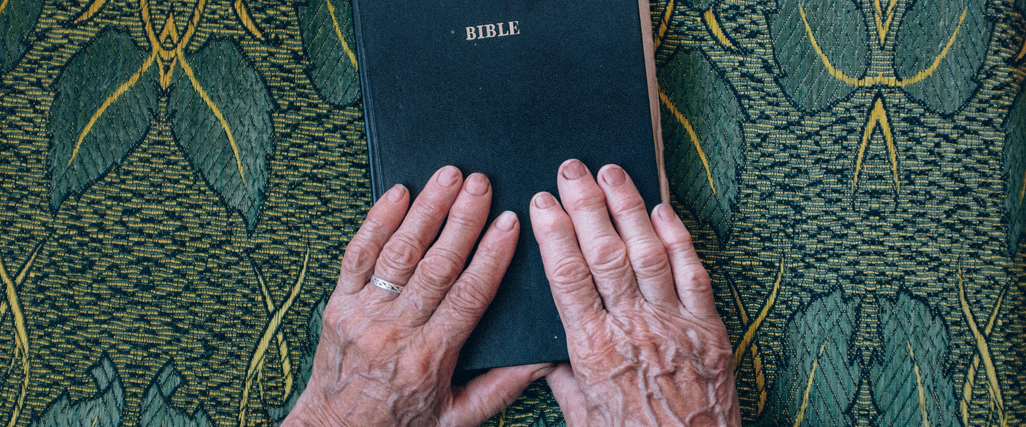 Hands on a Bible