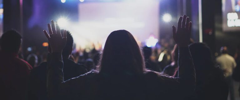 The back of a woman's head in a crowd