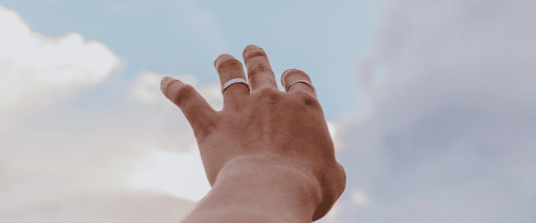 A hand reaches for the sky