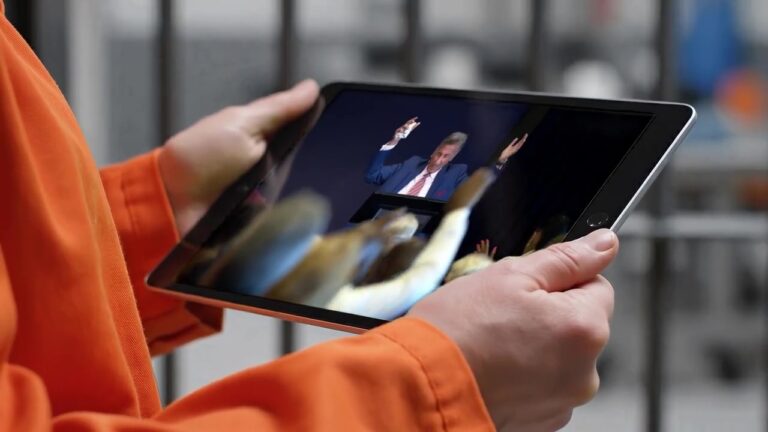 woman in prison using LTW app watching Michael Youssef preaching