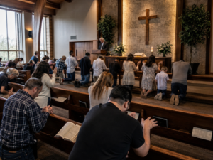 People sitting and praying in a traditional church